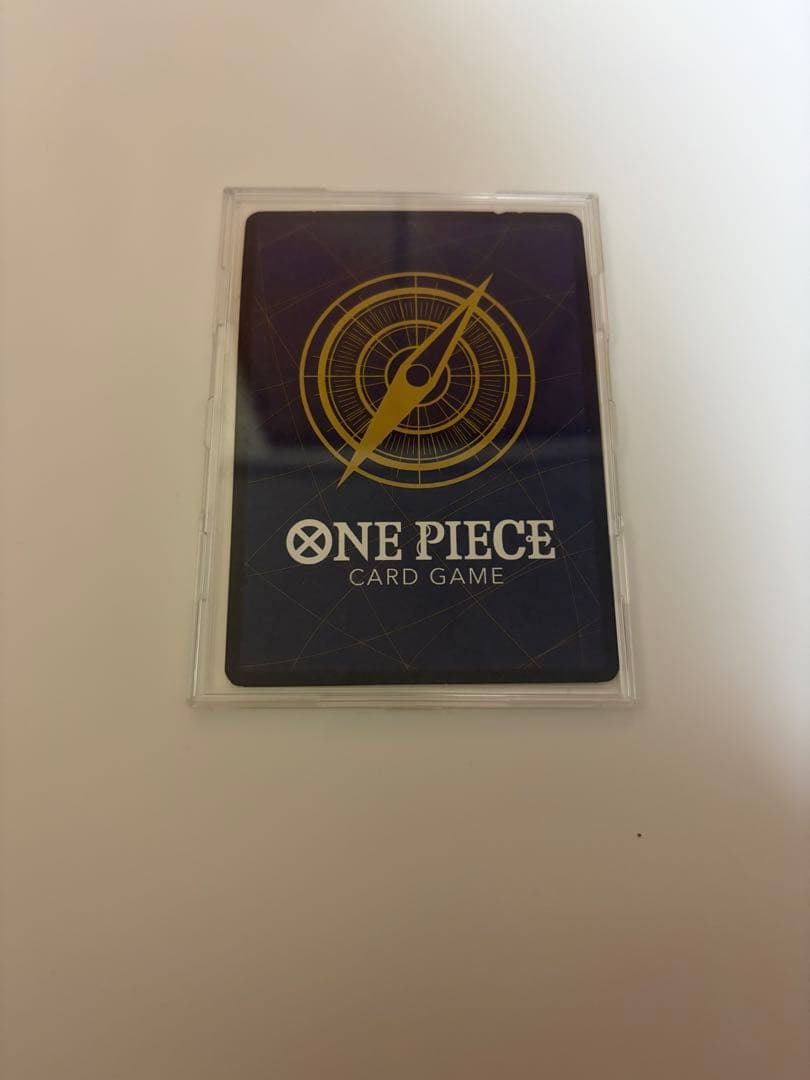 Used Monkey D. Luffy OP05 SR Japanese trading card from One Piece series with visible scratches and stored in case