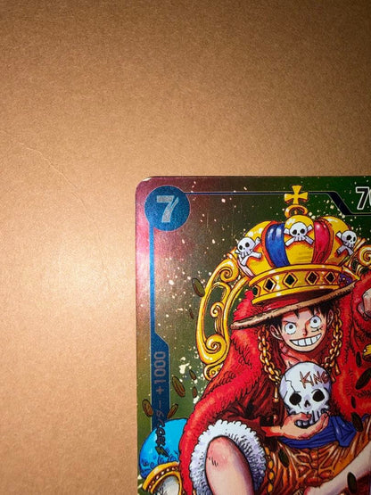 Used Monkey D. Luffy OP05 SR Japanese trading card from One Piece series with visible scratches and stored in case
