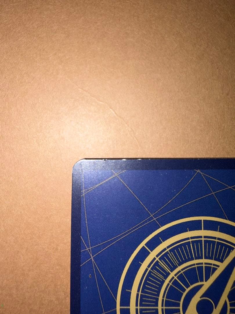 Used Monkey D. Luffy OP05 SR Japanese trading card from One Piece series with visible scratches and stored in case