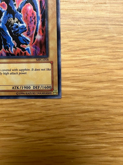 Yu-Gi-Oh Sapphire Dragon 1st edition Asia Ultra MFC trading card with visible initial scratches