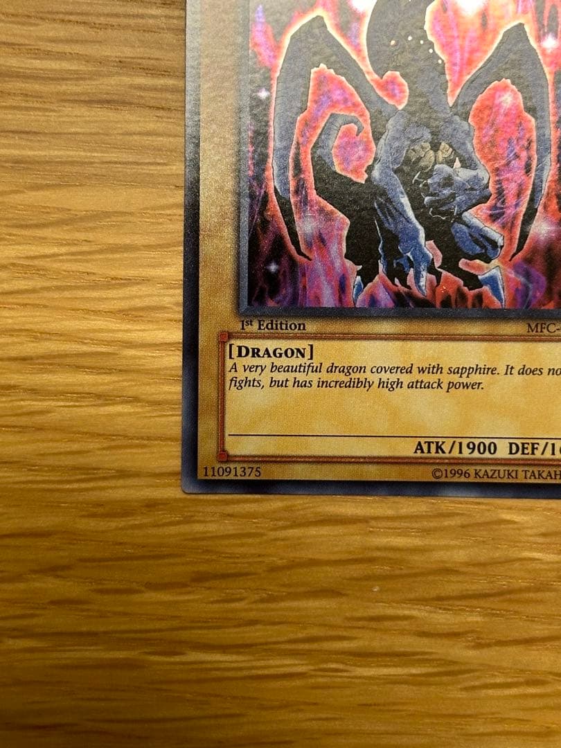 Yu-Gi-Oh Sapphire Dragon 1st edition Asia Ultra MFC trading card with visible initial scratches