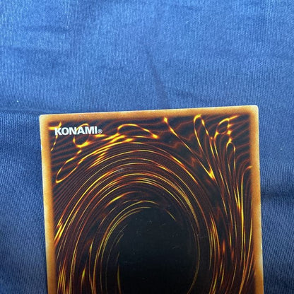 Konami Ultimate Great Mosus Chaos Soldier Red-Eyes Black Dragon trading card in protective sleeve and packaging