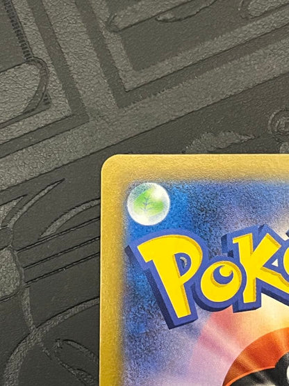 Bandai Pokemon Card Rayquaza VMAX CSR in a protective sleeve with colorful artwork