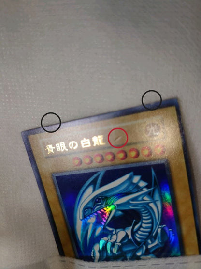Blue-Eyes White Dragon Initial Ultra Rare Yu-Gi-Oh trading card with minor wear, Japan import