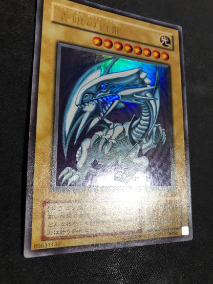 Yugioh OCG Blue-Eyes White Dragon LB-01 Ultra Rare Japanese trading card with visible wear