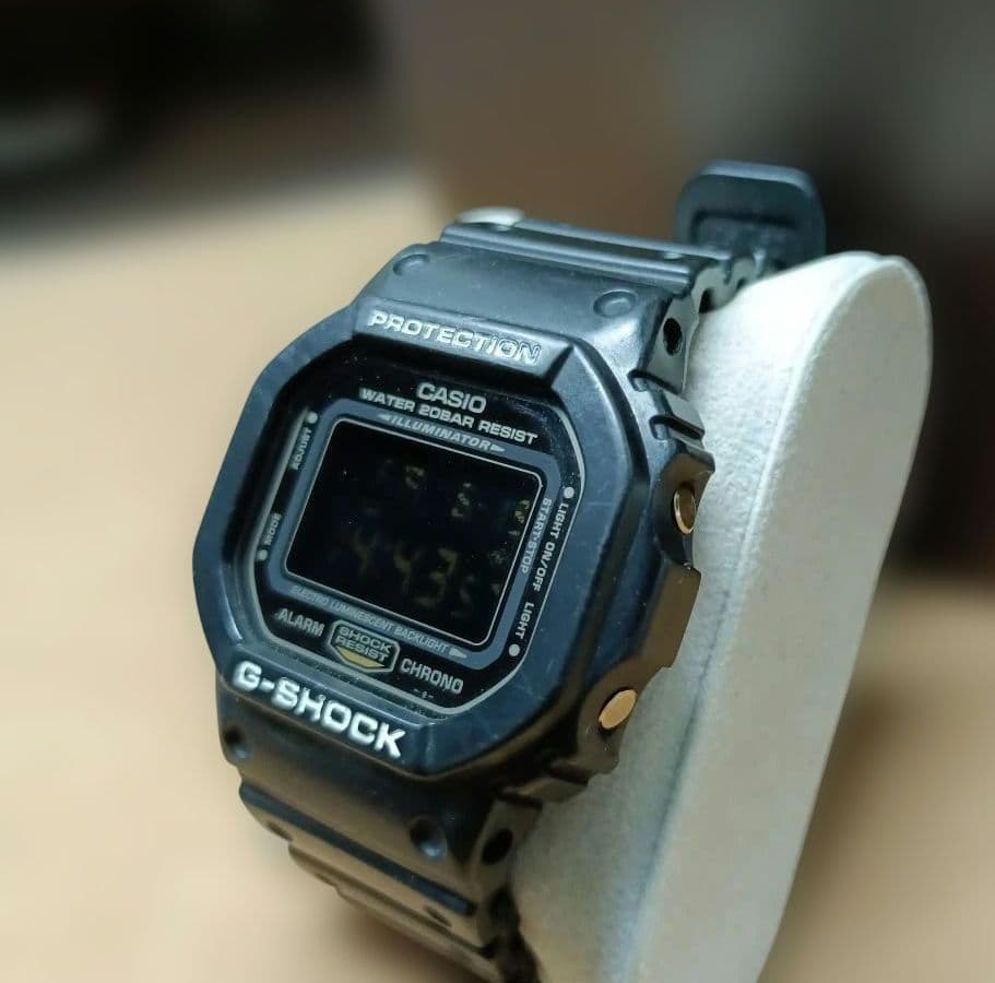 Casio G-Shock Speed Model DW-5600P Watch with Black Case and Reversed LCD Gold Text — Japan Import