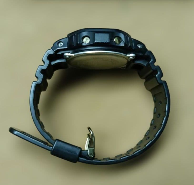 Casio G-Shock Speed Model DW-5600P Watch with Black Case and Reversed LCD Gold Text — Japan Import