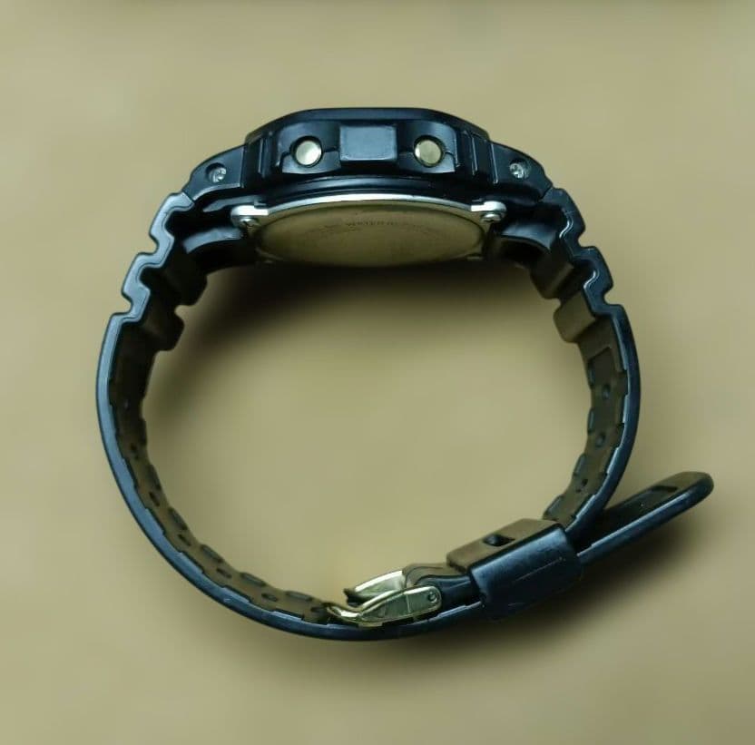 Casio G-Shock Speed Model DW-5600P Watch with Black Case and Reversed LCD Gold Text — Japan Import