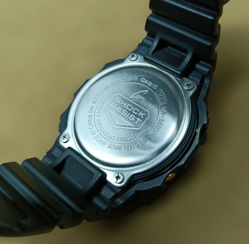 Casio G-Shock Speed Model DW-5600P Watch with Black Case and Reversed LCD Gold Text — Japan Import