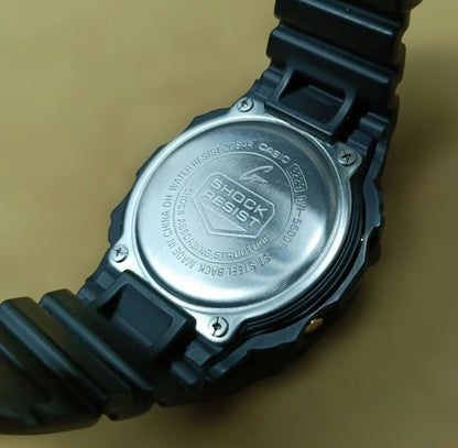 Casio G-Shock Speed Model DW-5600P Watch with Black Case and Reversed LCD Gold Text — Japan Import