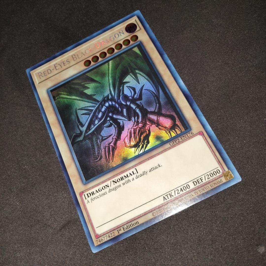 Yugioh Red-Eyes Black Dragon English Ghost Rare Foil card with image shifted lower left and white fog mark on back