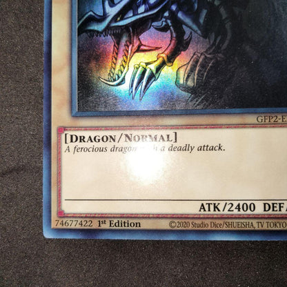 Yugioh Red-Eyes Black Dragon English Ghost Rare Foil card with image shifted lower left and white fog mark on back
