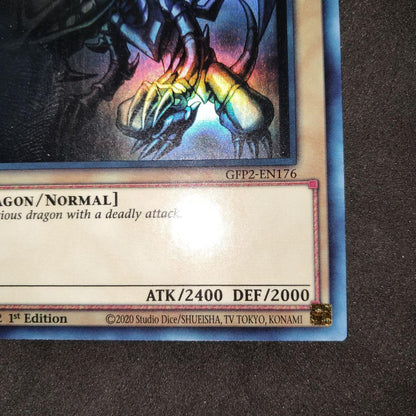 Yugioh Red-Eyes Black Dragon English Ghost Rare Foil card with image shifted lower left and white fog mark on back