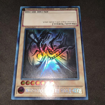 Yugioh Red-Eyes Black Dragon English Ghost Rare Foil card with image shifted lower left and white fog mark on back