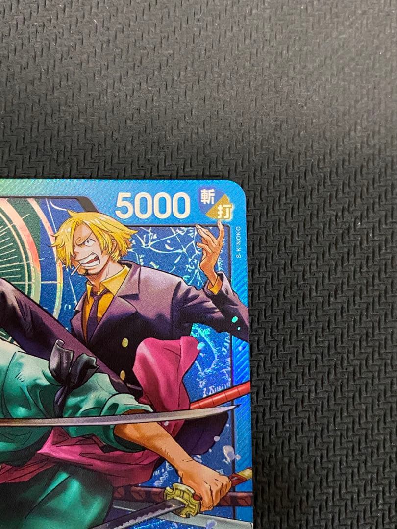 One Piece trading cards featuring Monkey D. Luffy ST14-001 and Zoro & Sanji ST12-001 pirate crew from Japan