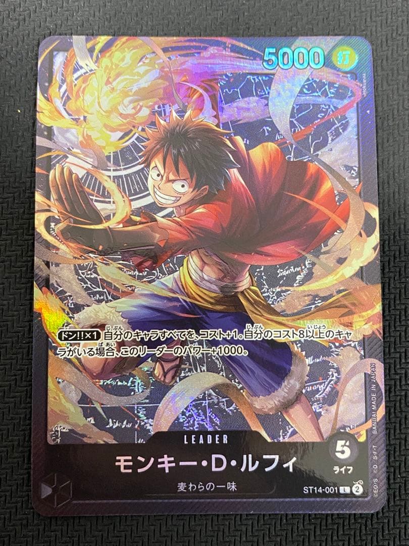 One Piece trading cards featuring Monkey D. Luffy ST14-001 and Zoro & Sanji ST12-001 pirate crew from Japan