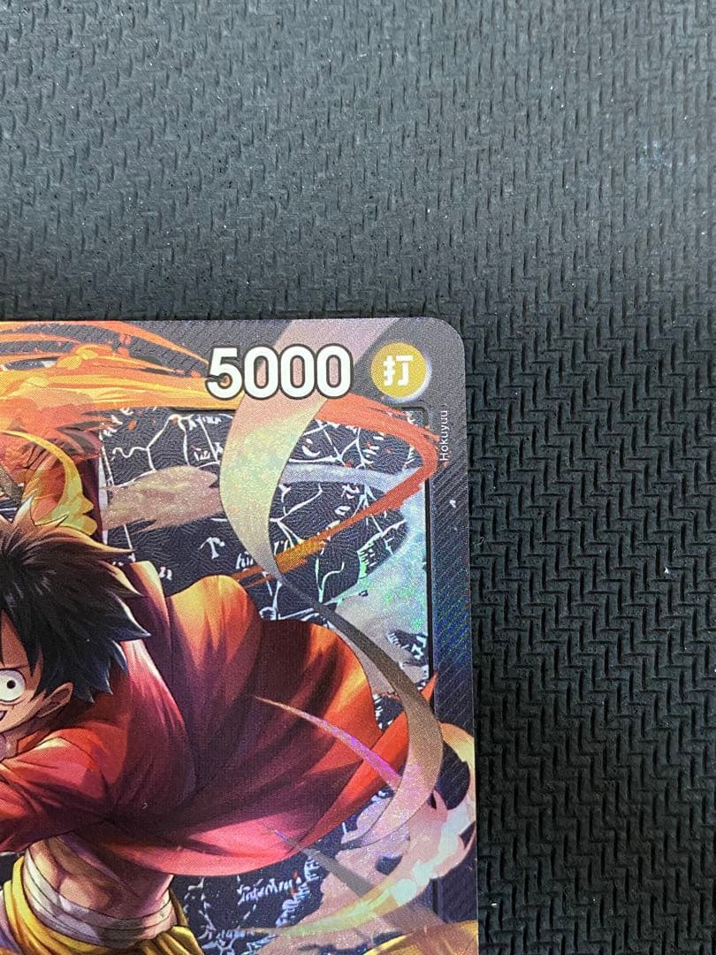 One Piece trading cards featuring Monkey D. Luffy ST14-001 and Zoro & Sanji ST12-001 pirate crew from Japan