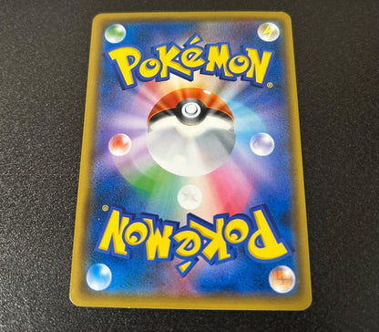 Bandai Red Pikachu figure from Pokémon Center 20th Anniversary Promotion in Japanese edition stored in protective sleeve