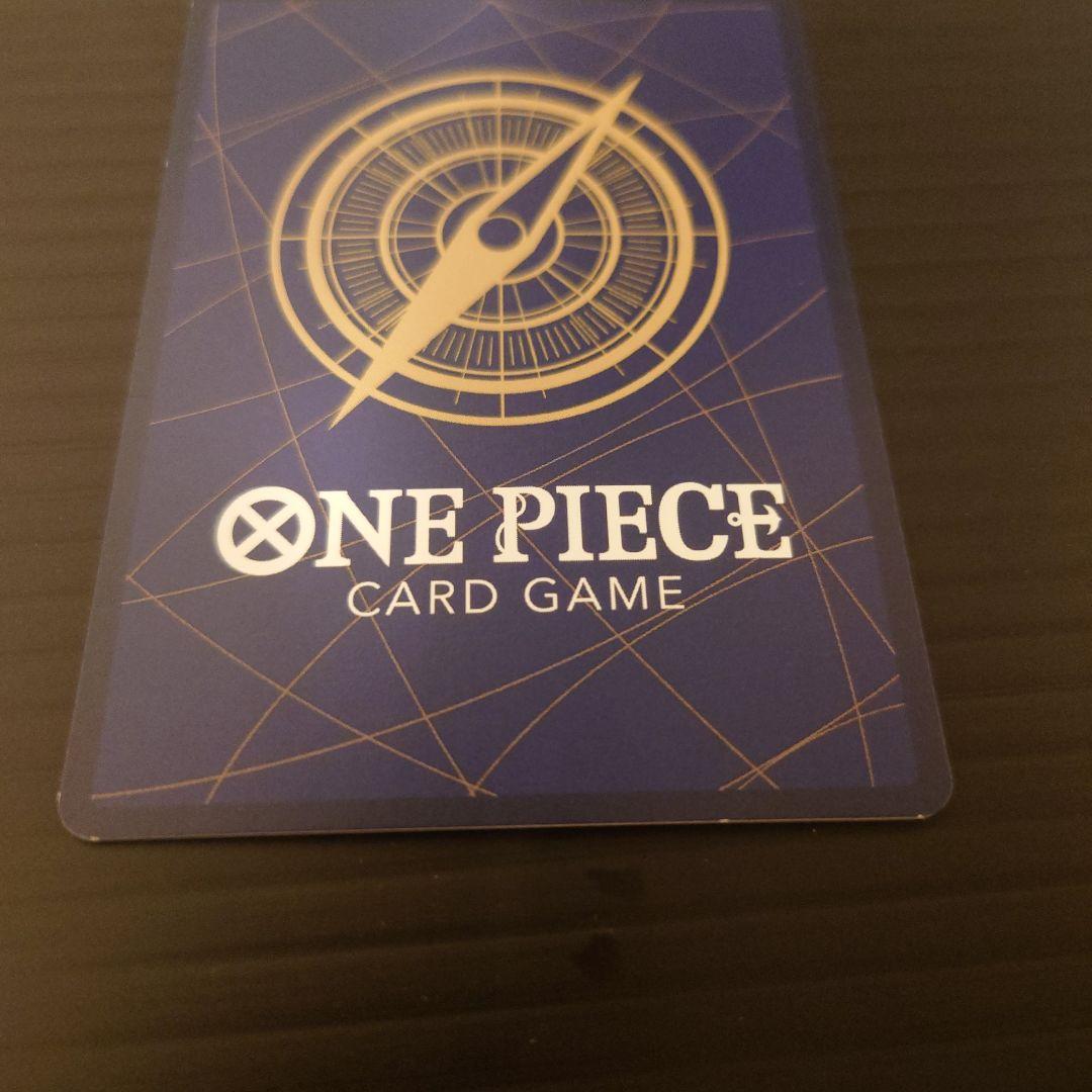 One Piece Riot Louma P-072 promo card from Japan wrapped in protective sleeves and cardboard packaging