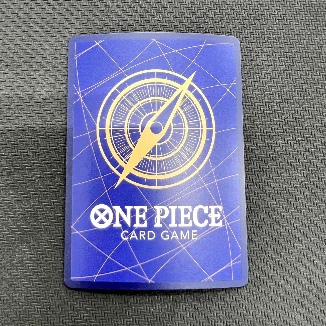 One Piece OP13 Kenpachi R Parallel event card with foil embossing in protective hard case