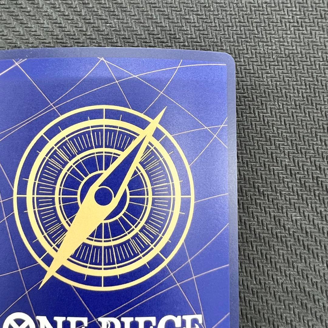 One Piece OP13 Kenpachi R Parallel event card with foil embossing in protective hard case