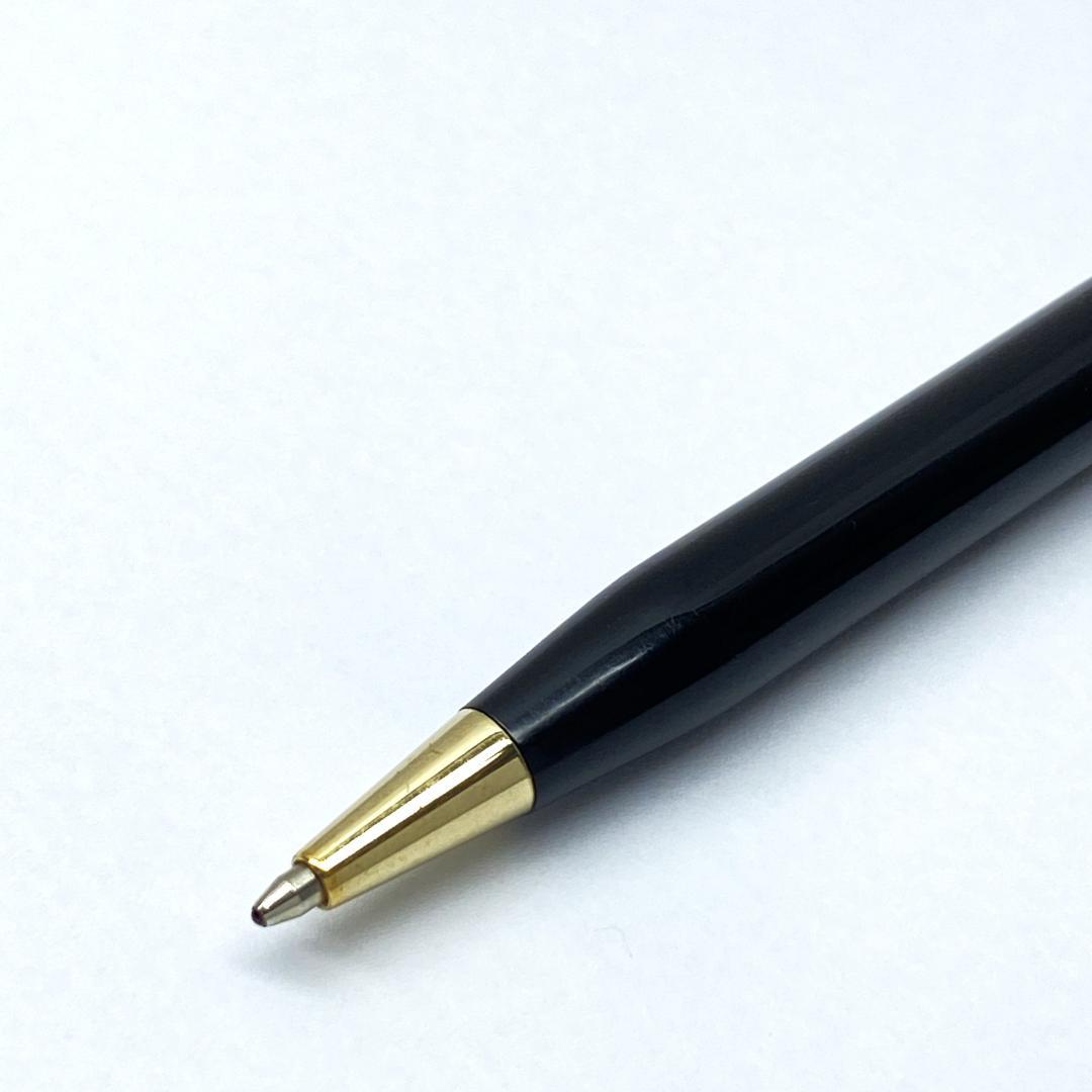 Cross Slim black ballpoint pen with twist mechanism and black ink, showing slight wear