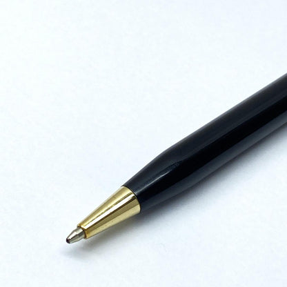 Cross Slim black ballpoint pen with twist mechanism and black ink, showing slight wear