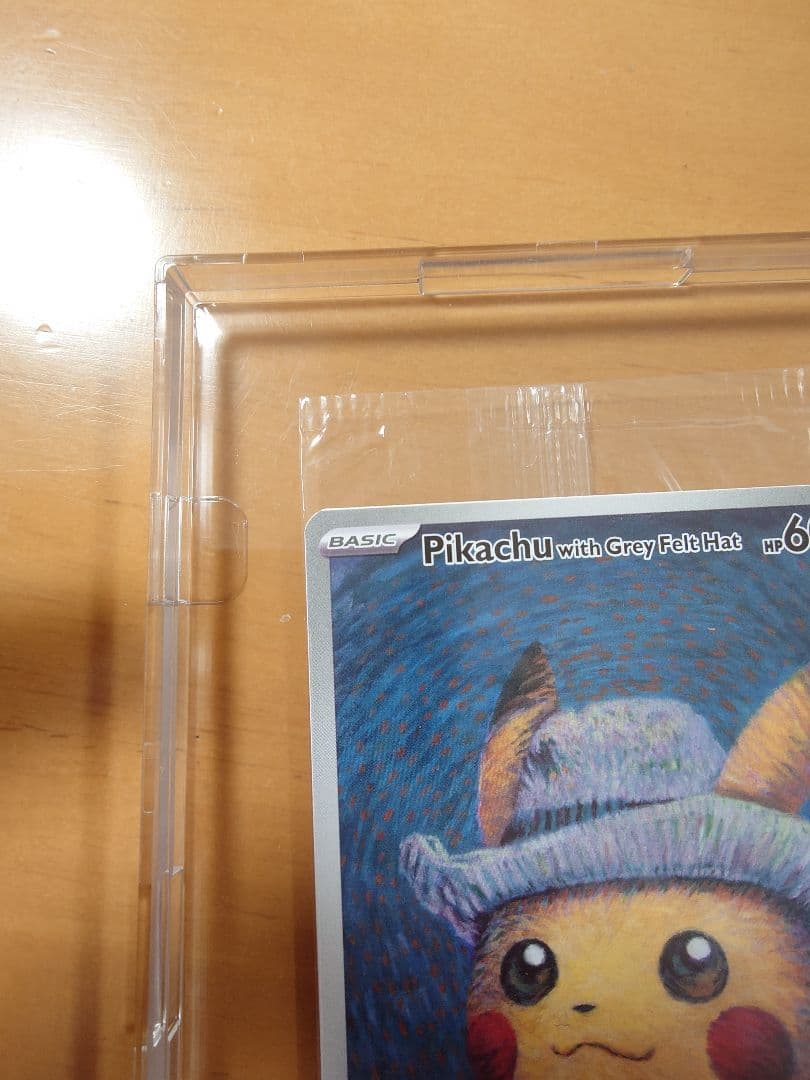 Bandai Pikachu promotional card SVP 085 with grey felt hat displayed in a dedicated frame