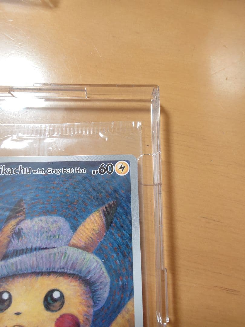 Bandai Pikachu promotional card SVP 085 with grey felt hat displayed in a dedicated frame