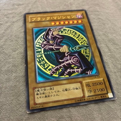 Black Magician LN-53 Yu-Gi-Oh TCG monster card with relief from Japan showing slight wear and bent corners