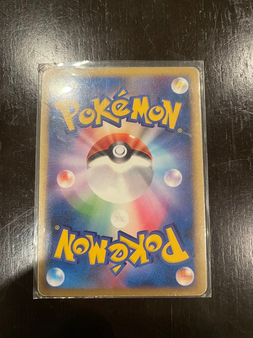 Pokémon Rayquaza C LV.73 1ed card in protective sleeve shown from front
