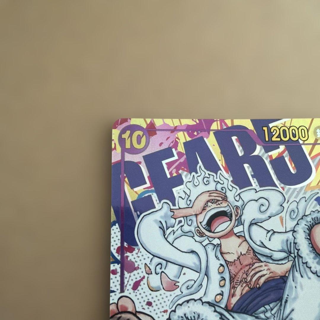 One Piece Luffy Nika Secret Parallel trading card showing front artwork of Luffy with minor white stain on back top