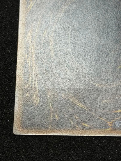 Blue-Eyes White Dragon Ultimate Rare Relief trading card with minor white paint missing on edges