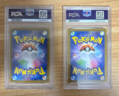PSA10 graded Pokémon cards featuring Ninfiaex and Boulaxex with serial numbers in a collector set