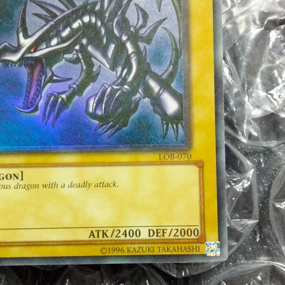 Red Eyes Misprint Error Double Error Card LOB-070 with faded foil shift and white shadow under Red Eyes