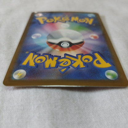 Bandai Pokemon Mega Darkrai EX Gold-shimmering Ultra Rare trading card with 280 HP and dark type
