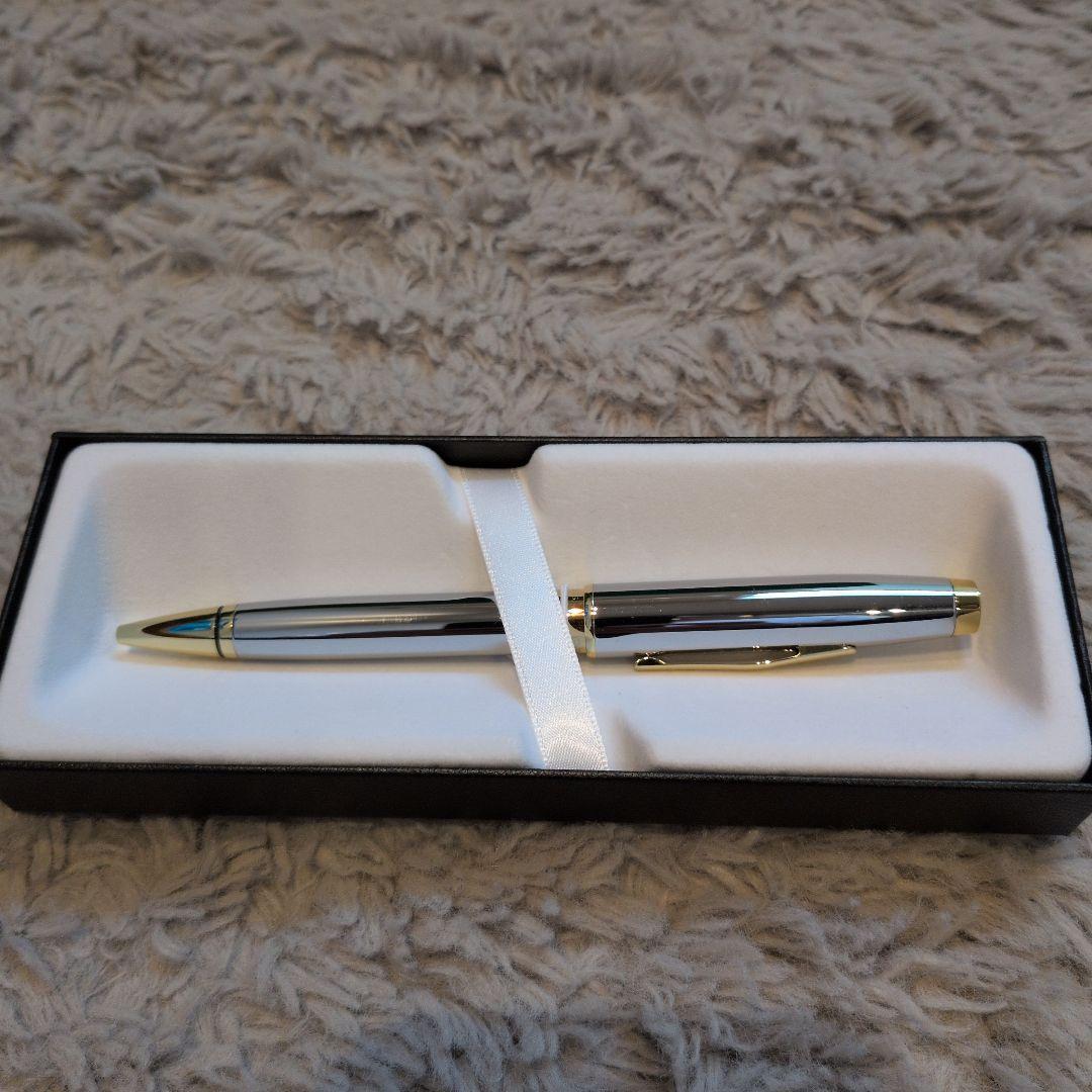 Cross ballpoint pen with clear silver body and gold contrasting accents