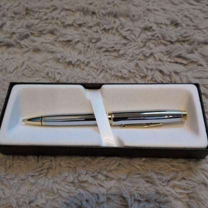 Cross ballpoint pen with clear silver body and gold contrasting accents