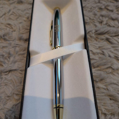 Cross ballpoint pen with clear silver body and gold contrasting accents