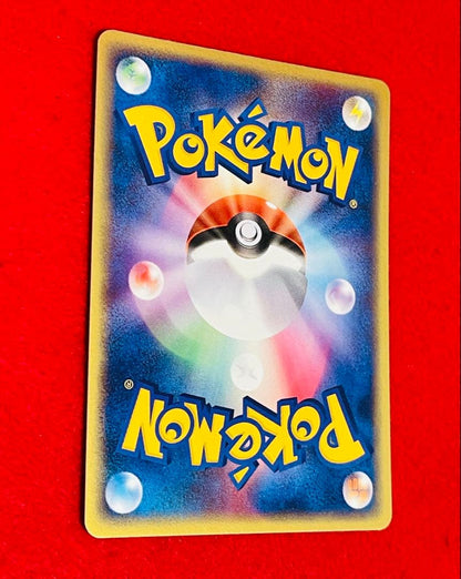 2003 Seven Eleven limited Flygon 032/ADV-P promotional Pokémon card in sleeve with side-loader and bag