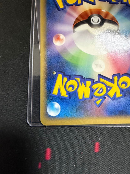 Victory Medal Promo 2006 featuring Pikachu character, stored in protective sleeve for Japan import