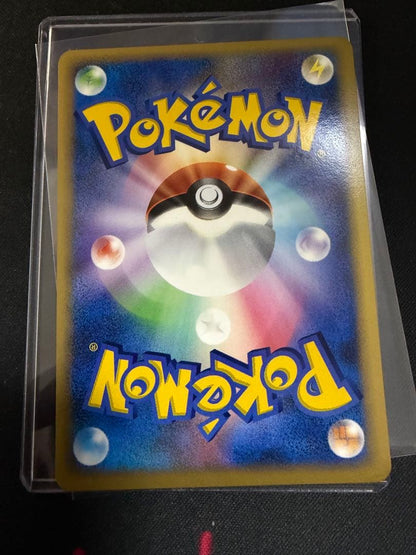 Victory Medal Promo 2006 featuring Pikachu character, stored in protective sleeve for Japan import