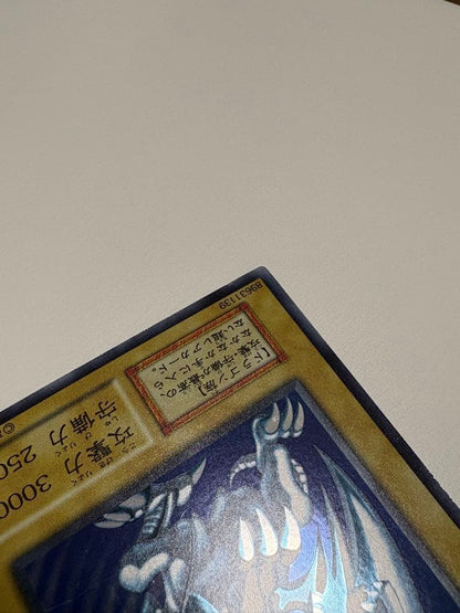 Yu-Gi-Oh Blue-Eyes White Dragon Ultra Rare Japanese trading card in protective sleeve and loader