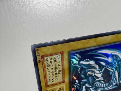 Yu-Gi-Oh Blue-Eyes White Dragon Ultra Rare Japanese trading card in protective sleeve and loader