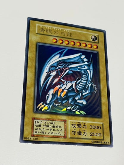 Yu-Gi-Oh Blue-Eyes White Dragon Ultra Rare Japanese trading card in protective sleeve and loader