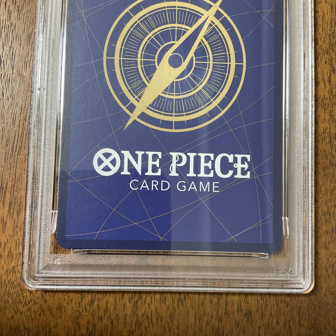 One Piece Card Game Parallel PSA 10 collectible card with case showing possible scratches and dirt