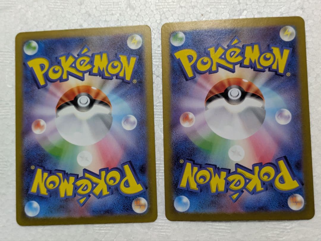 Pokemon promotional Pikachu and Nanjiamo Taiko Electric AR Card set kept in sleeves and loaders