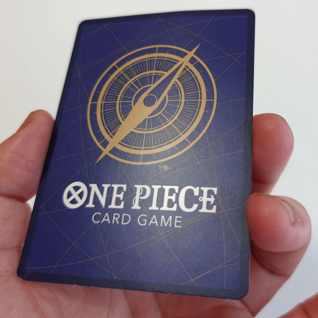 Bandai Monkey D. Luffy P-033 promo card from Japan stored in a card case with visible slight corner bends