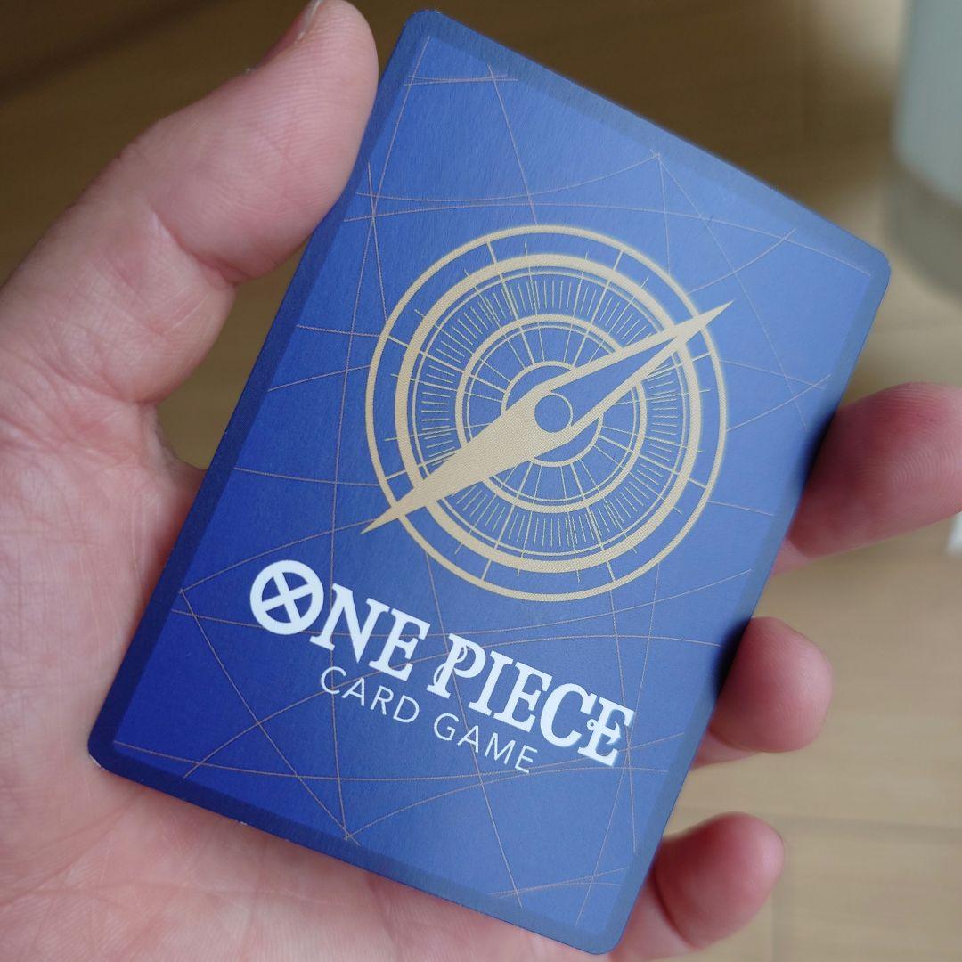 Bandai Monkey D. Luffy P-033 promo card from Japan stored in a card case with visible slight corner bends