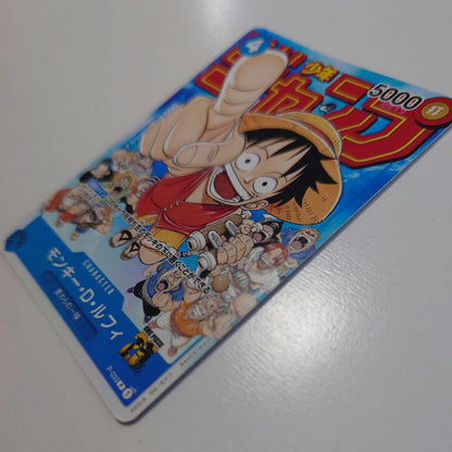 Bandai Monkey D. Luffy P-033 promo card from Japan stored in a card case with visible slight corner bends